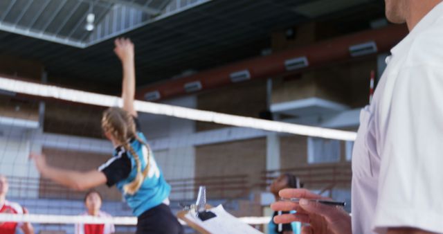 Caucasian girl plays volleyball in a gym, with copy space - Download Free Stock Photos Pikwizard.com