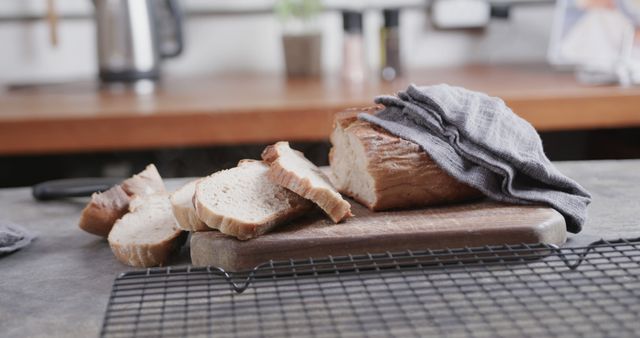 Freshly Baked Bread Loaf with Slices on Wooden Board in Kitchen - Download Free Stock Images Pikwizard.com