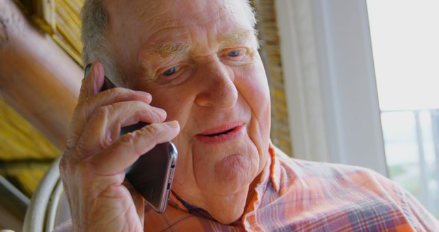 Elderly Man Talking on Smartphone at Home - Download Free Stock Images Pikwizard.com