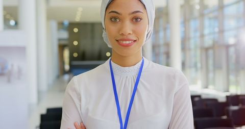 Confident Businesswoman Smiling in Office Lobby