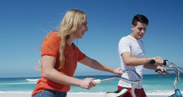 Happy Couple Riding Bicycles on Sunny Beach Day - Download Free Stock Images Pikwizard.com