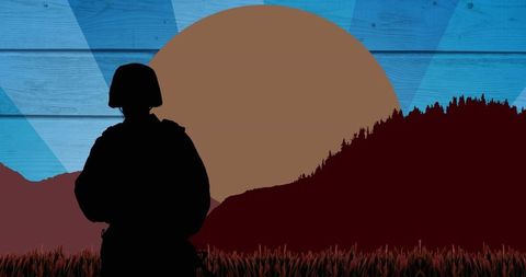 Silhouette of Soldier Against Mountain Landscape and Rising Sun