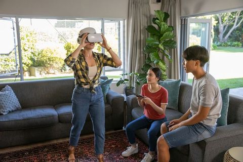 Family Experiencing VR in Cozy Living Room Setting