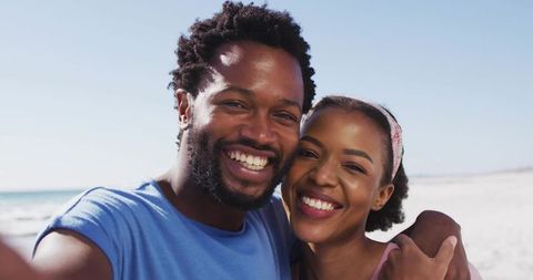 Happy Couple Enjoying a Beach Selfie Together