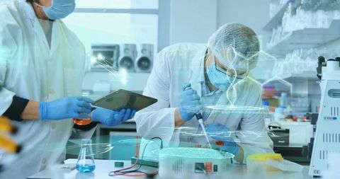 Scientists Conducting DNA Research in High Tech Laboratory