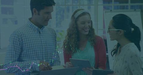 Colleagues Collaborating and Reviewing Data in Modern Office