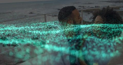 Couple Embracing by Sea with Digital Turquoise Overlay