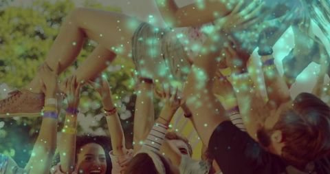 Crowdsurfing Festivalgoer Being Lifted by Friends in Park Showing Denim Shorts Pink Sneaker