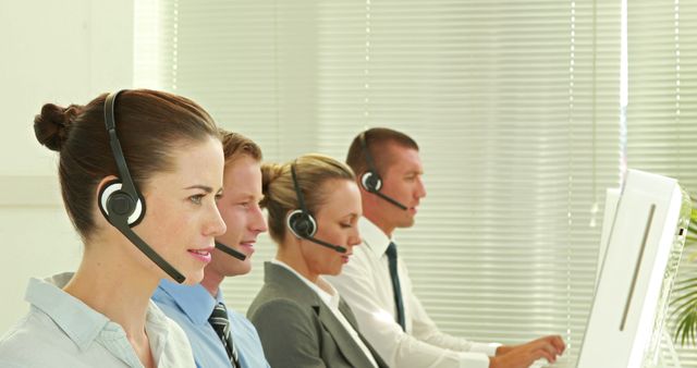 Row of Customer Service Representatives using Headsets - Download Free Stock Images Pikwizard.com