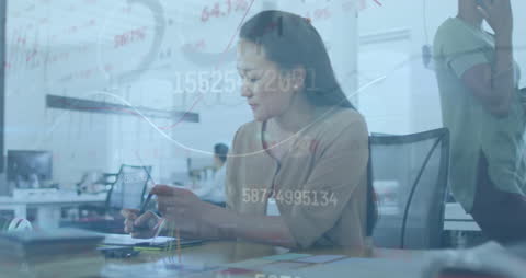 Woman Working with Financial Data and Digital Interface
