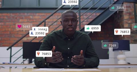 Live streaming presenter engaging audience with social reactions in modern office studio