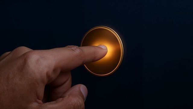 Pressing Finger Activating Glowing Circular Touch Button with Orange-Gold Halo