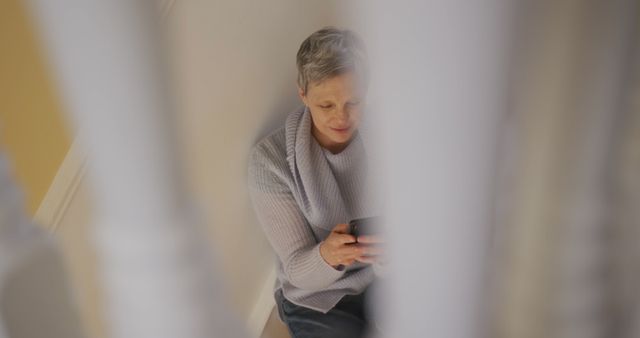 Senior Woman Relaxing with Smartphone at Home - Download Free Stock Images Pikwizard.com