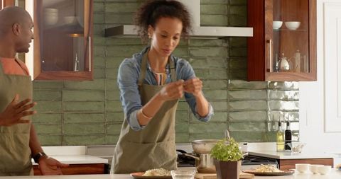 Couple Sharing Meal Preparation in Modern Home Kitchen