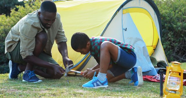 Father and Son Setting Up Tent on Camping Trip - Download Free Stock Images Pikwizard.com