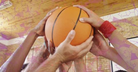 Team Bonding Through Unity with Basketball Close-Up in Gym