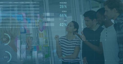 Team Collaborating Around Glass Whiteboard With Data Overlays and Sticky Notes