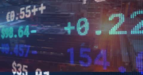 Digital Stock Market Numbers Overlay on Cityscape Sundown Scene