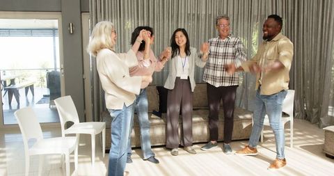 Diverse group embracing connection in therapy session