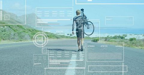 Man Walking with Bicycle on Scenic Coastal Road Infused with Data Overlays