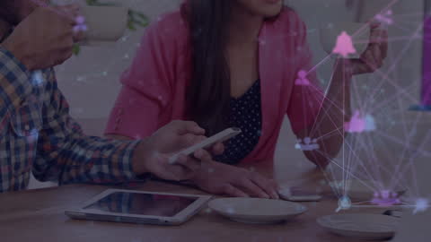 Business Team Discussing Digital Network with Technology Icons Overlay