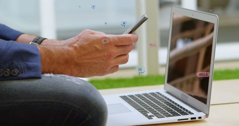 Person Interacting with Digital Social Media Icons on Phone and Laptop - Download Free Stock Images Pikwizard.com
