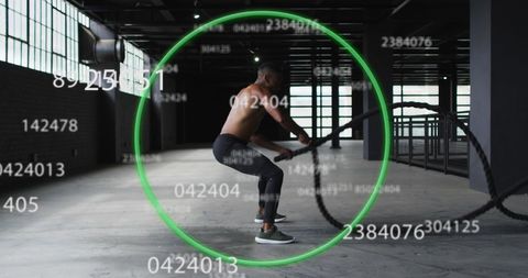 Man exercising with battle ropes and digital effects