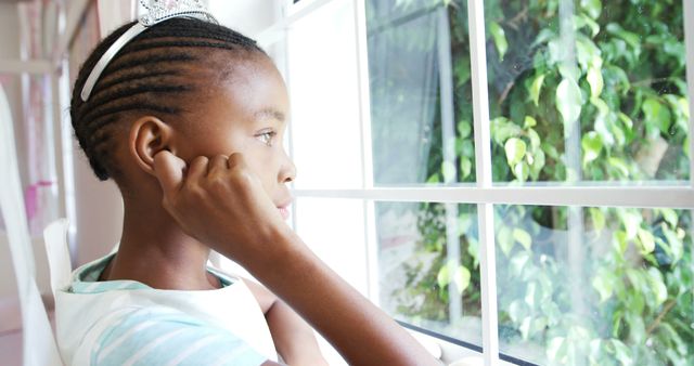 Thoughtful Young Girl Looking Out Window During Day - Download Free Stock Images Pikwizard.com