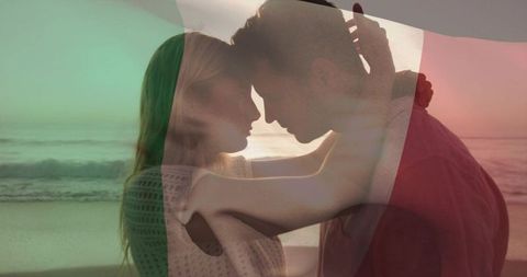 Romantic couple embracing at sunset on beach with tricolor flag overlay and silhouette