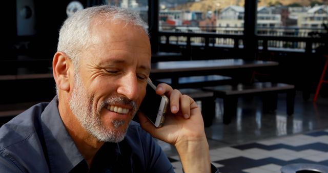 Senior Man Enjoying Conversation on Mobile Phone - Download Free Stock Images Pikwizard.com