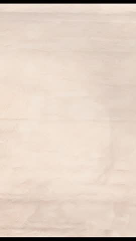 Vertical beige textured paper backdrop for mobile video, subtle neutral loopable abstract