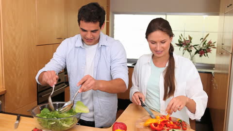 Couple Enjoying Time Cooking Together in Modern Kitchen