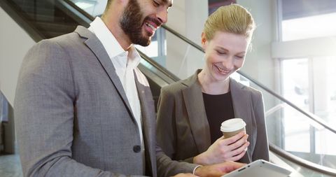 Business professionals engaging with technology at airport