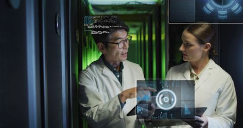 Scientists Discuss Data Visualizations in Advanced Server Room - Download Free Stock Images Pikwizard.com