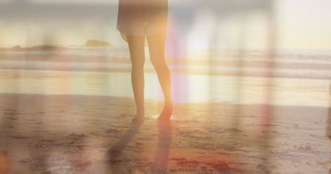 Woman on Beach During Sunset Taking Selfie Wearing Face Mask