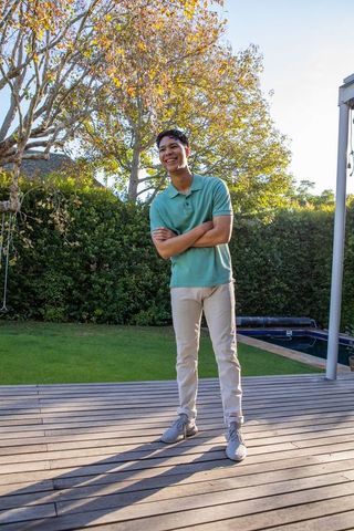 Young Man Relaxing on Deck in Casual Outfit