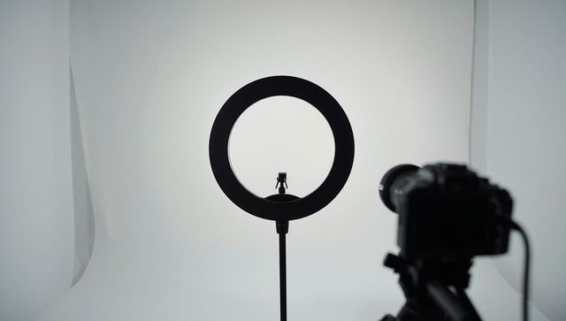 Studio setup with ring light and camera for professional photography