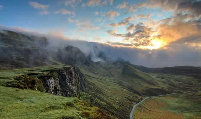 Scenic Sunrise Over Misty Mountain Landscape with Winding Road - Download Free Stock Photos Pikwizard.com