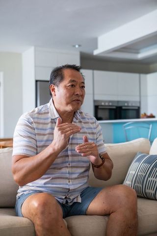 Senior Man Communicating Comfortably at Home