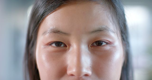 This visually striking close-up focuses on the eyes and facial features of an Asian woman, showcasing her natural beauty and emotion. The detail enriches any project related to beauty, skincare, mental health, or personal identity, making this perfect for advertisements, blog articles, and magazine spreads that emphasize authentic portrayal.