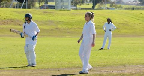 Women Athletes Engaged in Active Cricket Match