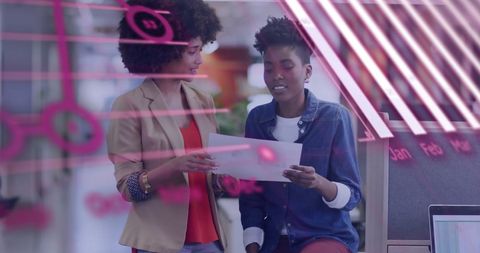 Colleagues analyzing fintech data in modern office