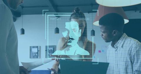 Diverse team analyzing facial recognition hologram during collaborative technology briefing