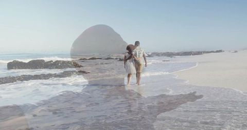 Romantic Couple Walking on Tranquil Beach with Dreamy Silhouette