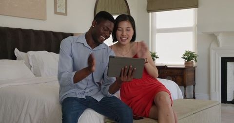 Diverse Couple Enjoying Technology Together in Modern Home Setting