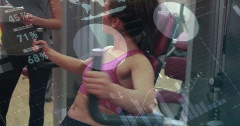 Woman exercising in gym with digital progress tracking