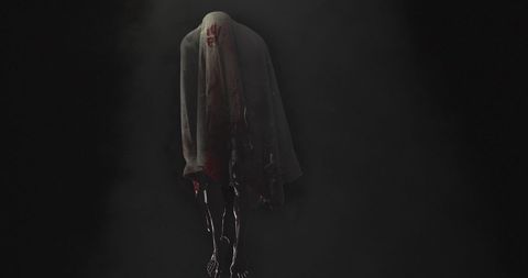 Mysterious Ghost Silhouette with Ominous Red Stain