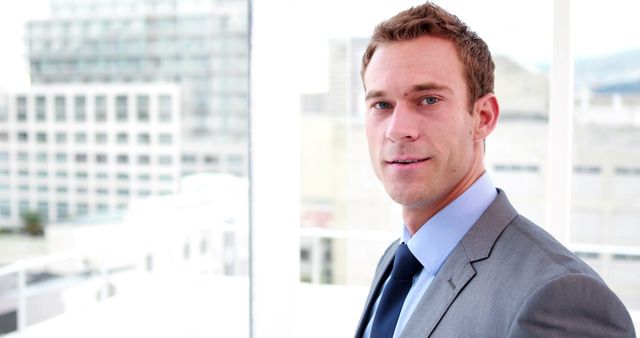 Confident Businessman Wearing Suit in Modern Office - Download Free Stock Images Pikwizard.com