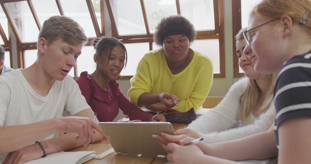 Diverse Group of Students Collaborating on Assignment in Classroom - Download Free Stock Images Pikwizard.com