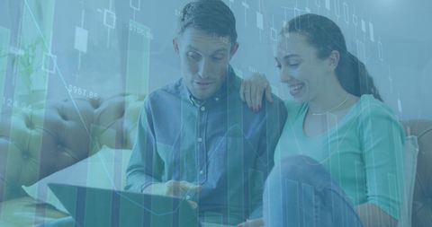 Couple Analyzing Financial Data for Investment Decisions